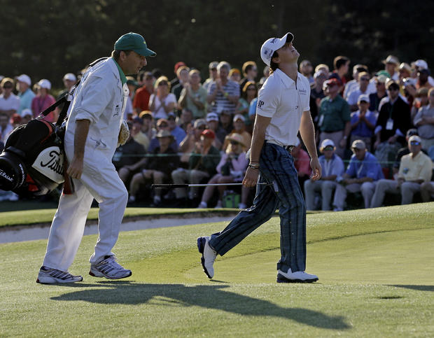 Rory McIlroy reacts when he sees how close his ball landed next to the cup 