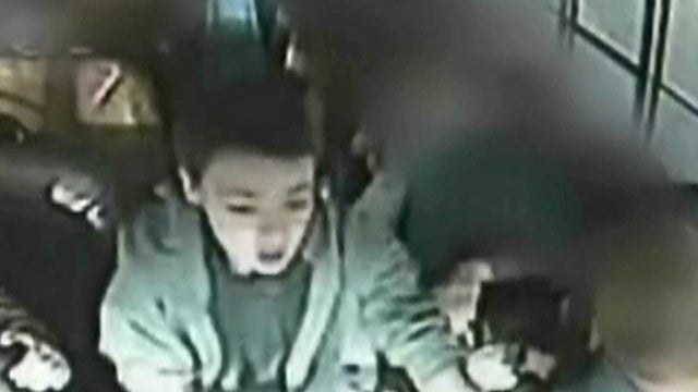 Kid takes wheel of a school bus 
