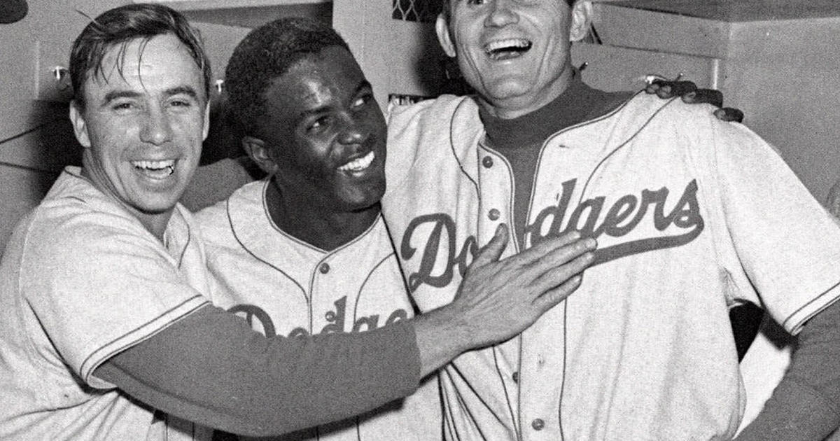 Jackie Robinson, who broke baseball's color barrier, alongside his Brooklyn  Dodgers teammates in 1947. (Robinson pictured with John Jorgensen, Pee Wee  Reese and…