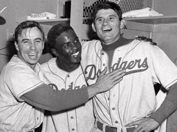Brooklyn Dodgers from left, Pee Wee Reese, Jackie Robinson, and Preacher Roe are a happy trio 
