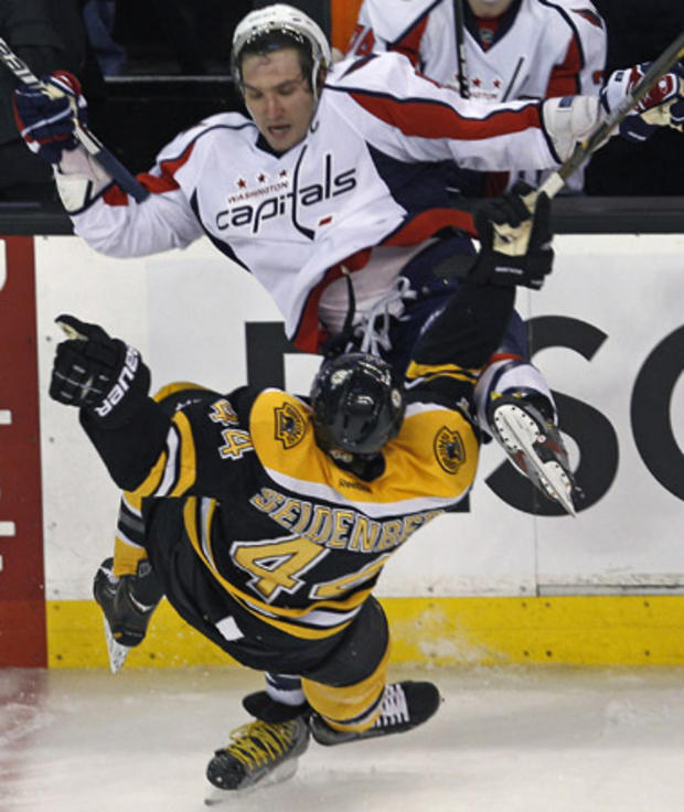 Alex Ovechkin drops Dennis Seidenberg to the ice on a hard check  