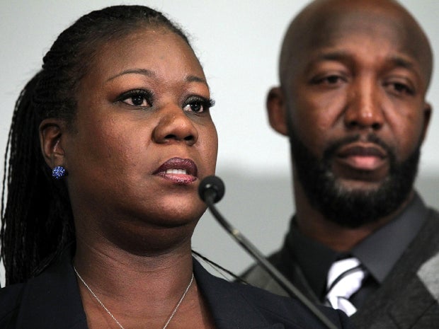 Trayvon Martin's mother, Sybrina Fulton, speaks as father Tracy Martin listens during a news conference April 11, 2012, in Washington about their son, who was fatally shot by neighborhood watch captain George Zimmerman in Florida.