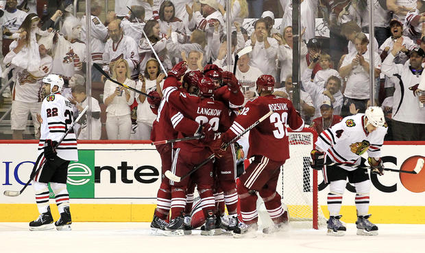 Michal Rozsival, Daymond Langkow and Keith Yandle celebrate a goal by Taylor Pyatt 
