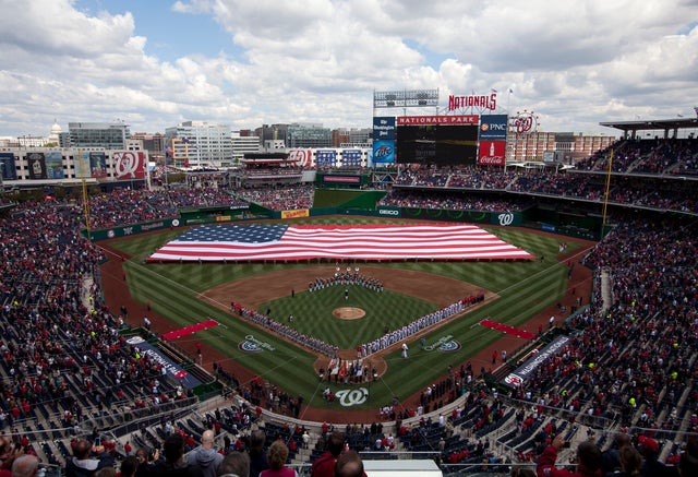 An American flag is presented for the National Anthem 
