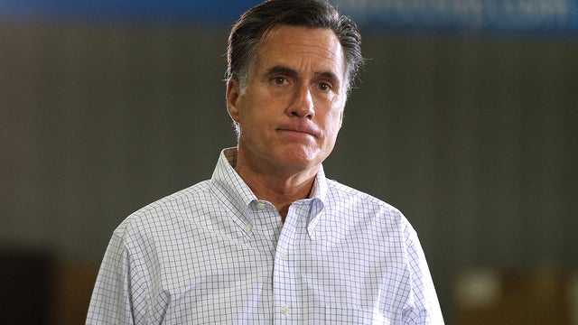 Mitt Romney pauses as he speaks during a town hall style meeting 