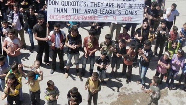 Supporters of Syrian President Bashar Assad drive cars covered in the Syrian national flag during a demonstration in Damascus, Syria, April 17, 2012, to mark Syrian Independence Day. 