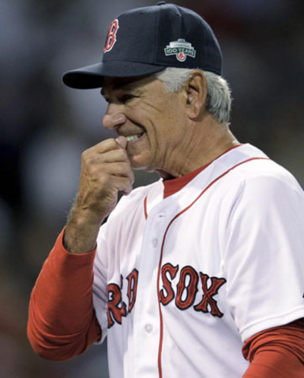 Bobby Valentine walks back to the dugout after removing starting pitcher Jon Lester 