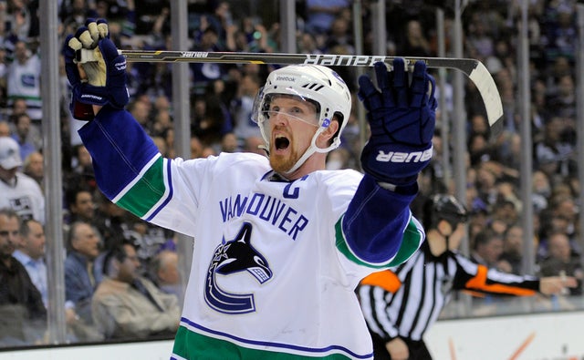 Henrik Sedin celebrates his goal during the third period 
