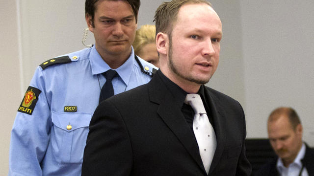 Right-wing extremist Anders Behring Breivik walks to take his seat in the witness box at the central court in Oslo, Norway, April 20, 2012. 
