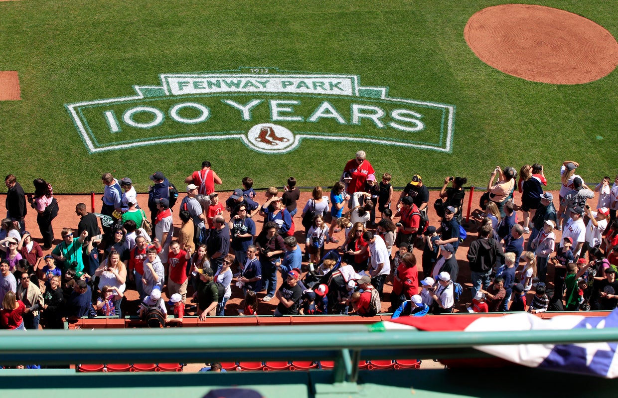 Lines of baseball fans make their way along the infield at Fenway Park in Boston 