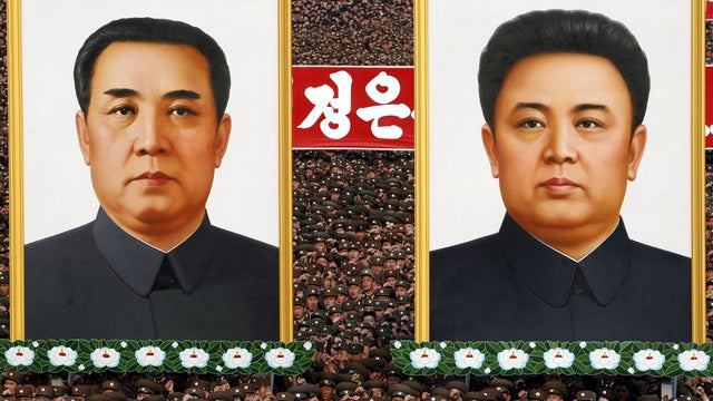 North Korean soldiers chant slogans near the portraits of late leaders Kim Il Sung, left, and Kim Jong Il at Kim Il Sung Square in Pyongyang, North Korea, during a rally denouncing South Korean President Lee Myung-bak April 20, 2012. 