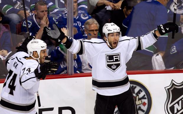 Jarret Stoll and Dwight King celebrate after Stoll scored the game-winning goal  