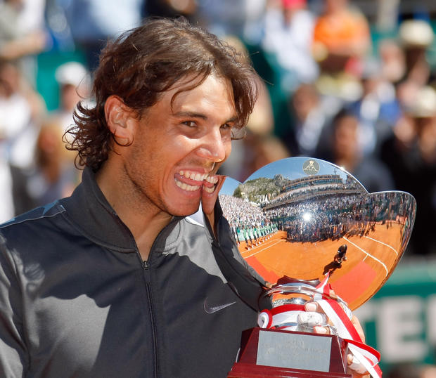 Spain's Rafael Nadal reacts with his trophy 