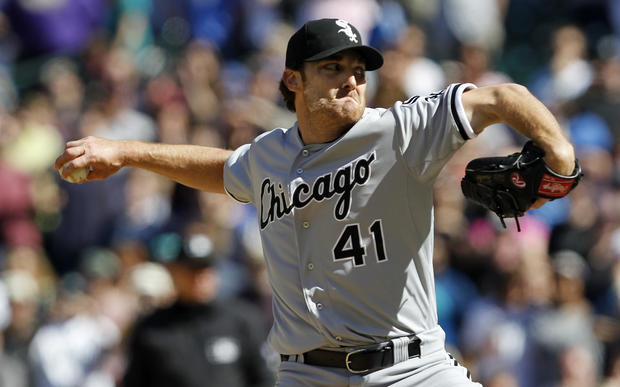 Chicago White Sox starting pitcher Phil Humber throws to the final batter 