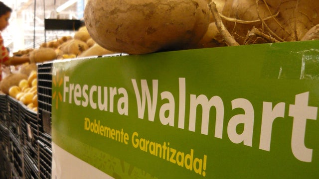 A woman shops in the produce aisle of a Wal-Mart store April 23, 2012, in Mexico City. 
