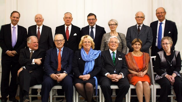 Current and former Swedish politicians and diplomats pose for a picture prior to a formal dinner at Sweden's government headquarters in Stockholm on April 16, 2012.  