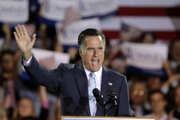 Mitt Romney takes the stage at an election night rally 