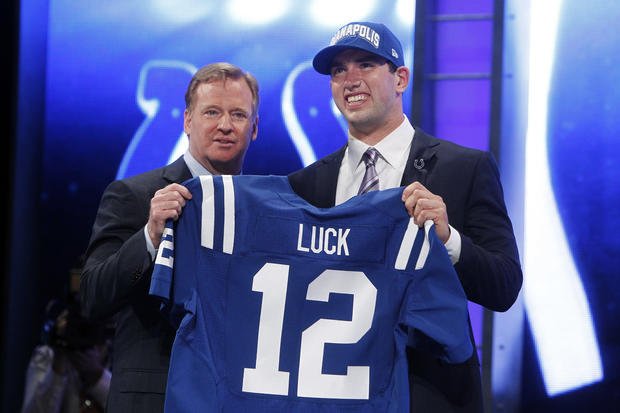 Andrew Luck poses for photographs with NFL Commissioner Roger Goodell 