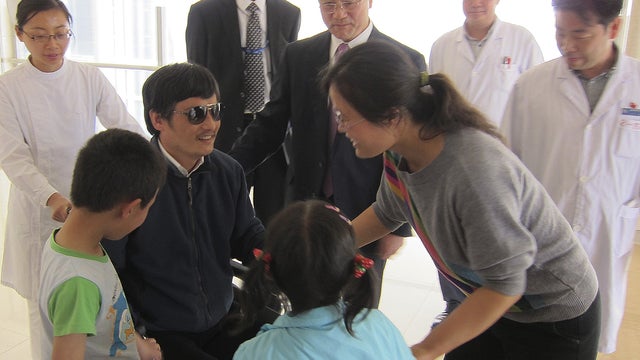 Chen Guangcheng is reuinited with his family at a Beijing hospital 
