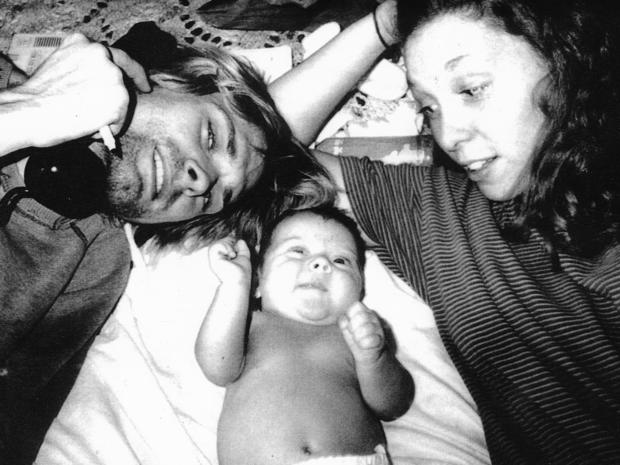 Kurt Cobain, his daughter Francis Bean Cobian, and Hole drummer Patty Schemel, in a photo taken while living together in 1992. (Photo by Courtney Love) 