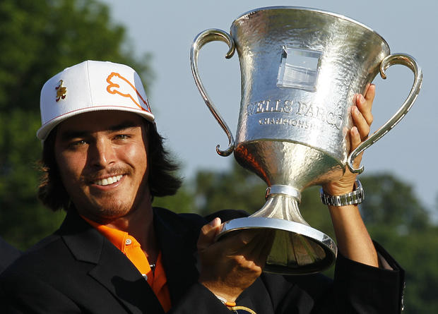 Rickie Fowler holds the trophy after winning the Wells Fargo Championship  