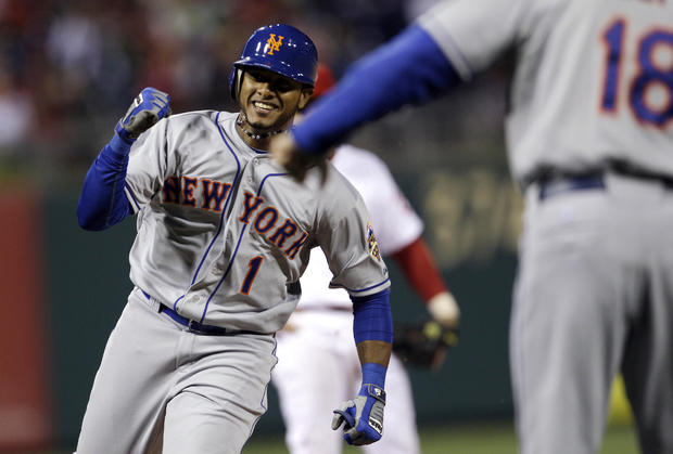 Jordany Valdespin smiles as he rounds the bases after hitting a three-run home run 
