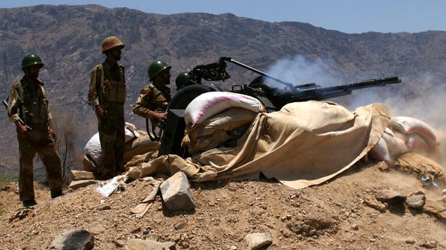 Yemeni army soldiers fire artillery at al Qaeda militants' positions near the southern town of Loder, Yemen, April 30, 2012. 