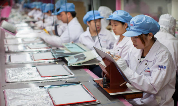 Foxconn employees working on Apple products. 