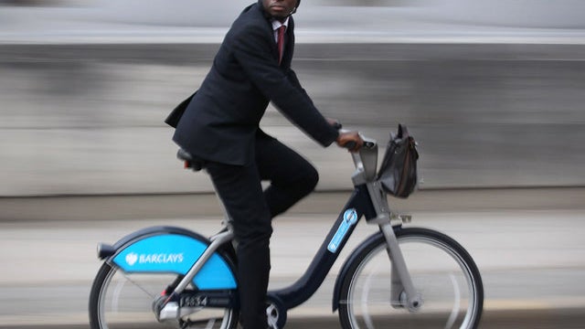 A Londoner rides a Barclays hire bike on September 6, 2010 across Waterloo Bridge.  