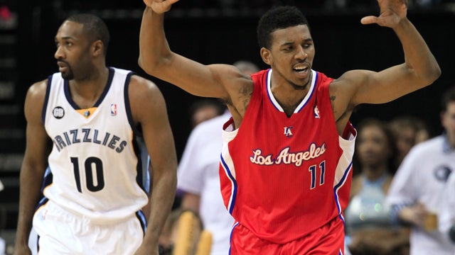 Nick Young celebrates after hitting a  three-point basket 