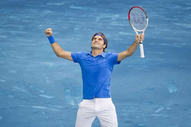Roger Federer celebrates after defeating Tomas Berdych 