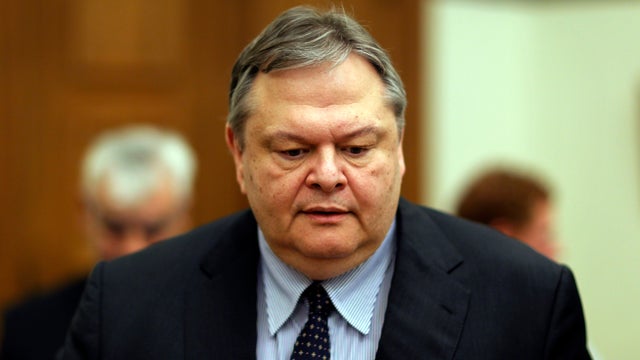 Greeces' Socialist leader Evangelos Venizelos arrives at a press room after meeting with leader of Coalition of the Radical Left party, SYRIZA, Alexis Tsipras, at the Greek Parliament in Athens, May 11 2012.  