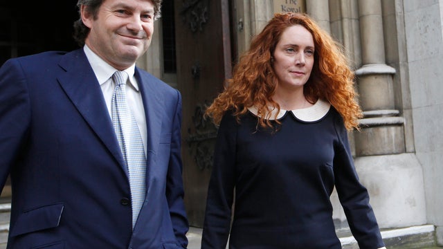 Rebekah Brooks, former chief executive of News International and her husband Charlie Brooks leaving the High Court in London on May 11, 2012.  