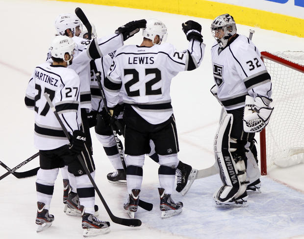 Jonathan Quick  is congratulated by teammates 