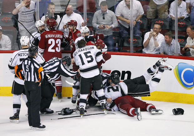 Members of the Phoenix Coyotes and Los Angeles Kings fight 