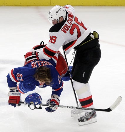 Anton Volchenkov and Carl Hagelin collide 