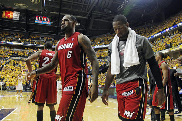 LeBron James and Dwyane Wade leave the court after losing  