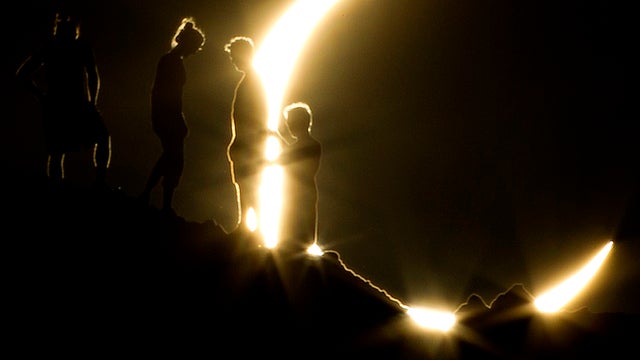 Hikers watch an annular eclipse from Papago Park in Phoenix May 20, 2012. 