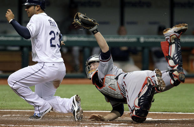 Brian McCann, right, tags out Tampa Bay Rays' Carlos Pena  