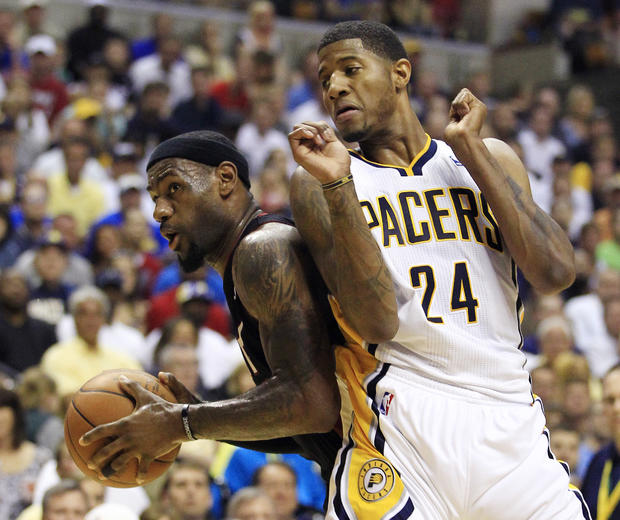 LeBron James is fouled by Indiana Pacers' Paul George  