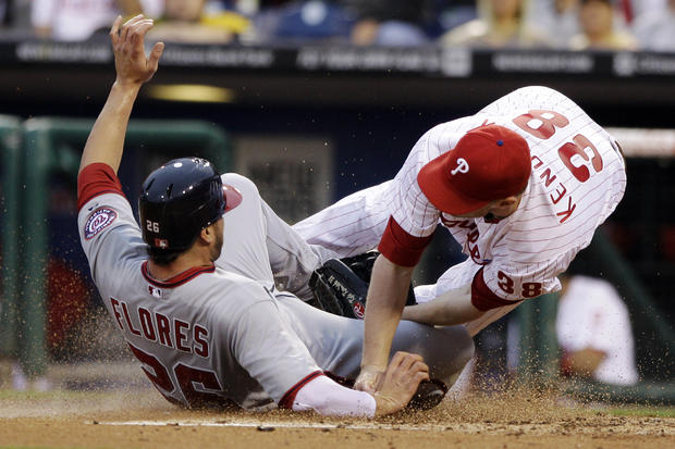 Jesus Flores collides with Phillies starting pitcher Kyle Kendrick  