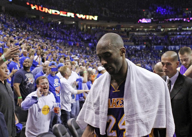 Kobe Bryant walks off the court after their 106-90 loss 