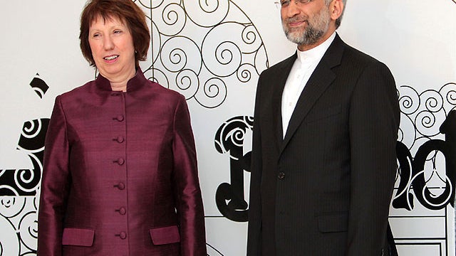 Iran's chief nuclear negotiator and head of Iran's national security council Saeed Jalili poses with European Union's foreign policy chief Catherine Ashton before a meeting in the Iraqi capital Baghdad on May 23, 2012.  