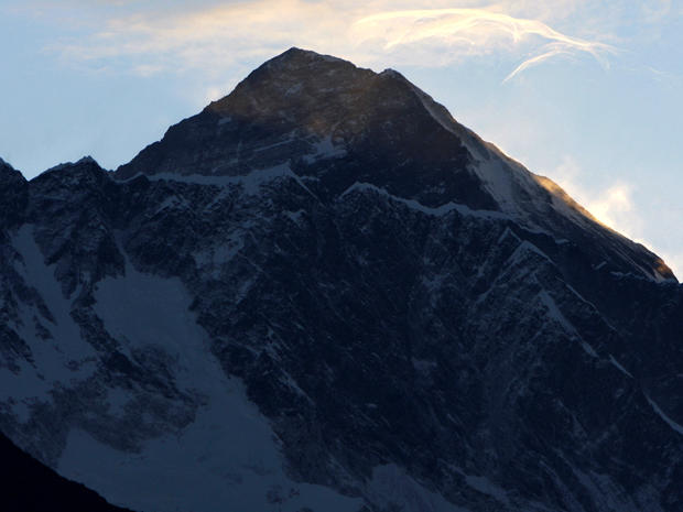 Clouds hover above the world's highest peak, Mount Everest, as seen from Syangboche, Nepal, May 19, 2010. 