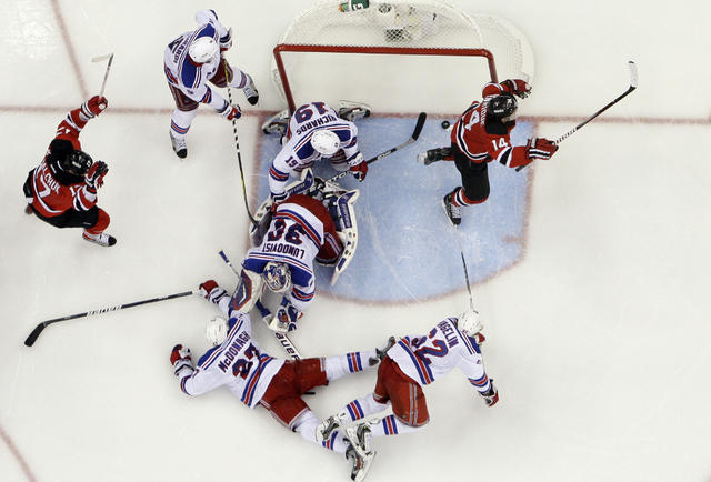Los Angeles Kings defenseman Alec Martinez (27) scores a goal past New  Jersey Devils goalie Martin Brodeur (30) in the second period in game 3 of  the NHL Stanley Cup Finals at
