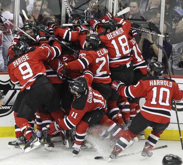 The New Jersey Devils celebrate after beating the New York Rangers 