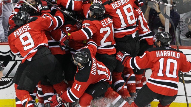 The New Jersey Devils celebrate after beating the New York Rangers 
