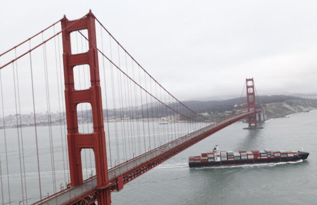 A tanker is seen passing through under the Golden Gate Bridge 