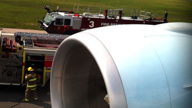 This photo taken by passenger Jason Flick shows an Air Canada flight after it made an emergency landing in Toronto following an engine failure, May 28, 2012. 