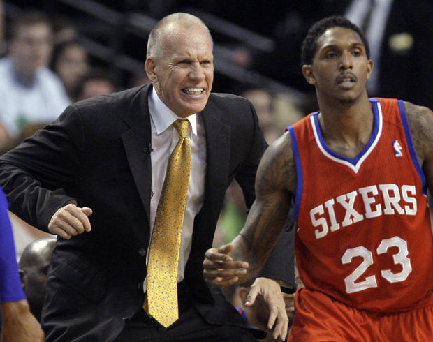 Doug Collins reacts on the sidelines with guard Lou Williams  